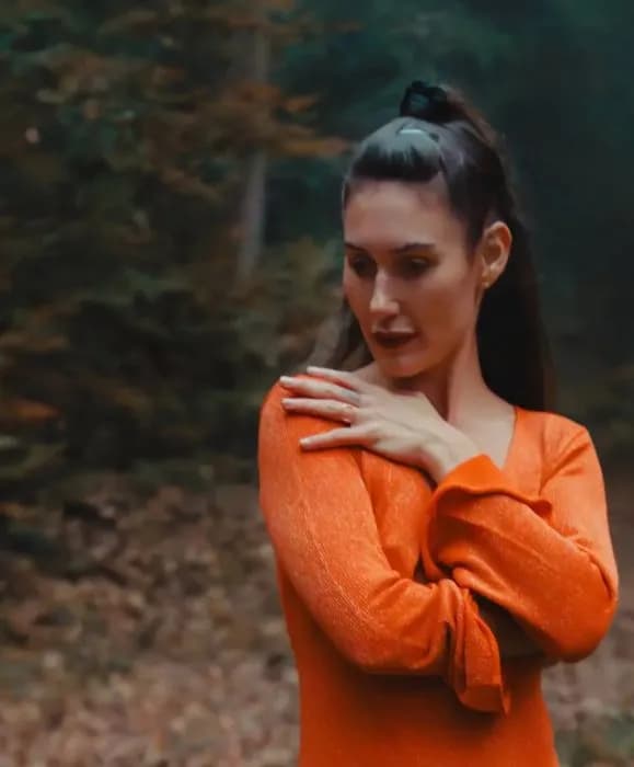 Woman practicing breathwork meditation in a peaceful setting